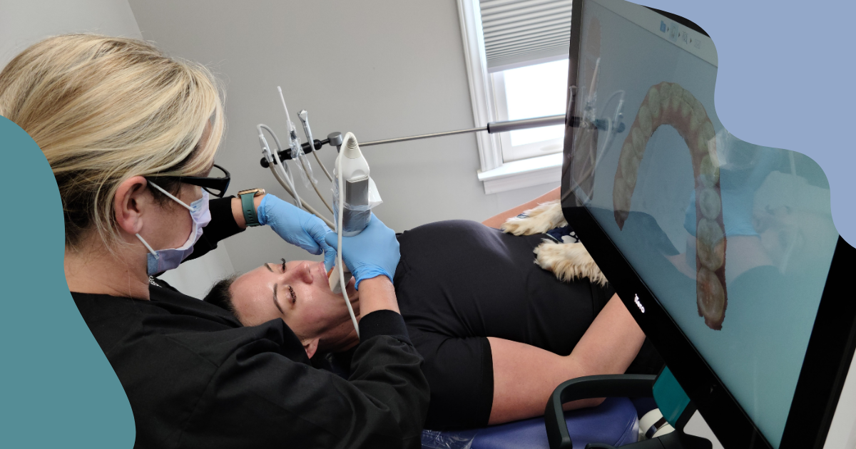 A patient receiving an intraoral scan as part of their digital dentistry examination