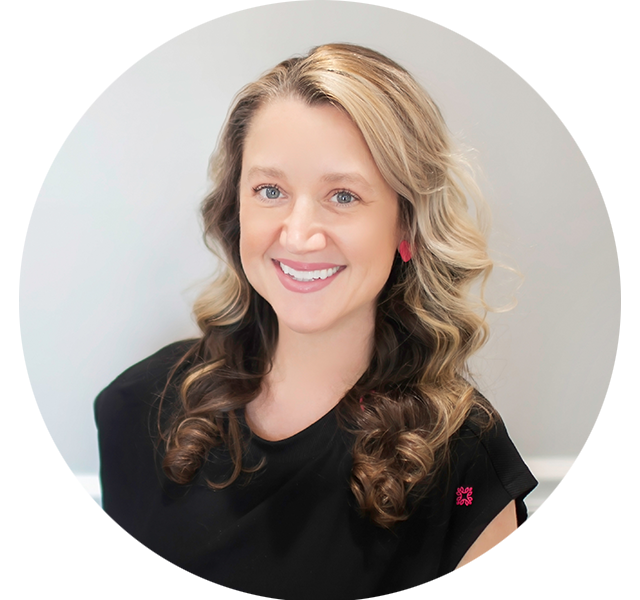 Michelle, dental hygienist at Bass Dentistry in Gastonia, NC, smiling brightly in a black uniform with over 20 years of dental experience